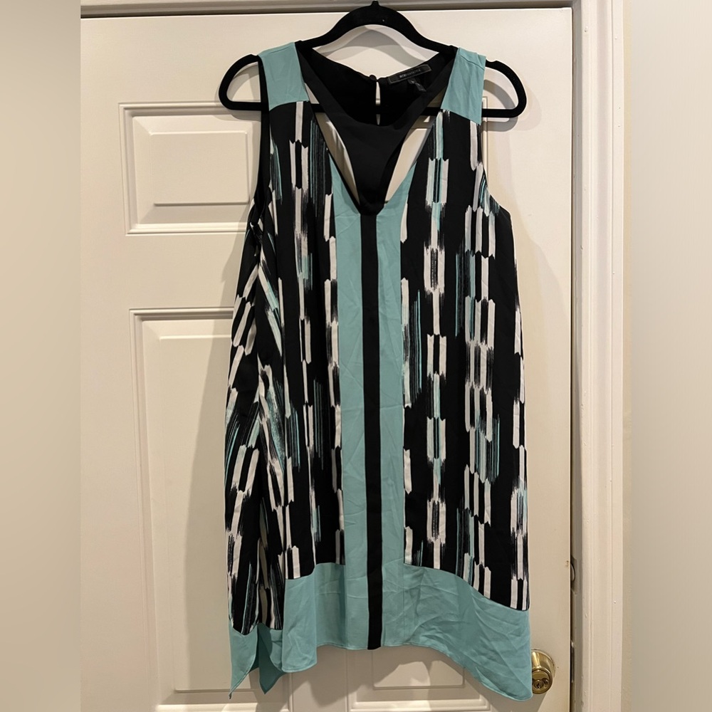 Sleeveless dress w/ cutouts around neck and chest. Southwestern, bohemian style